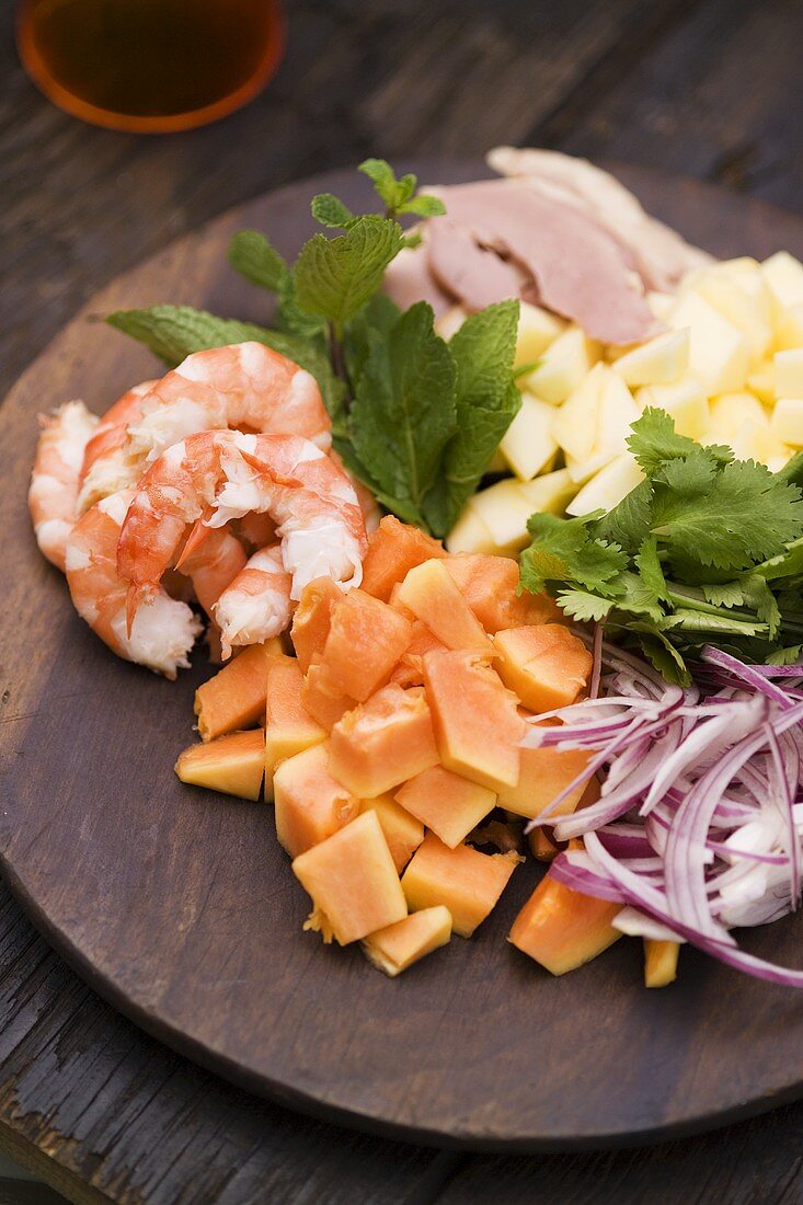Fruit, shrimps and duck breast (ingredients for exotic salad)