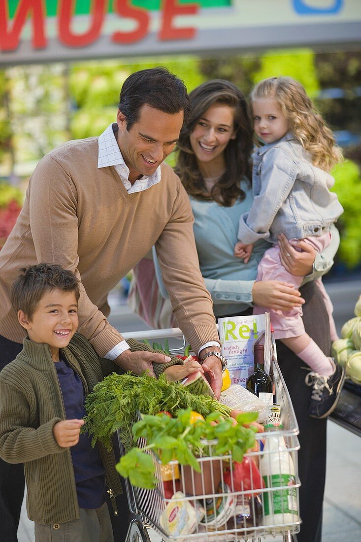 Family shopping in supermarket