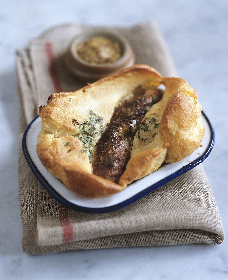Toad in the hole (Sausages in Yorkshire pudding batter, England)