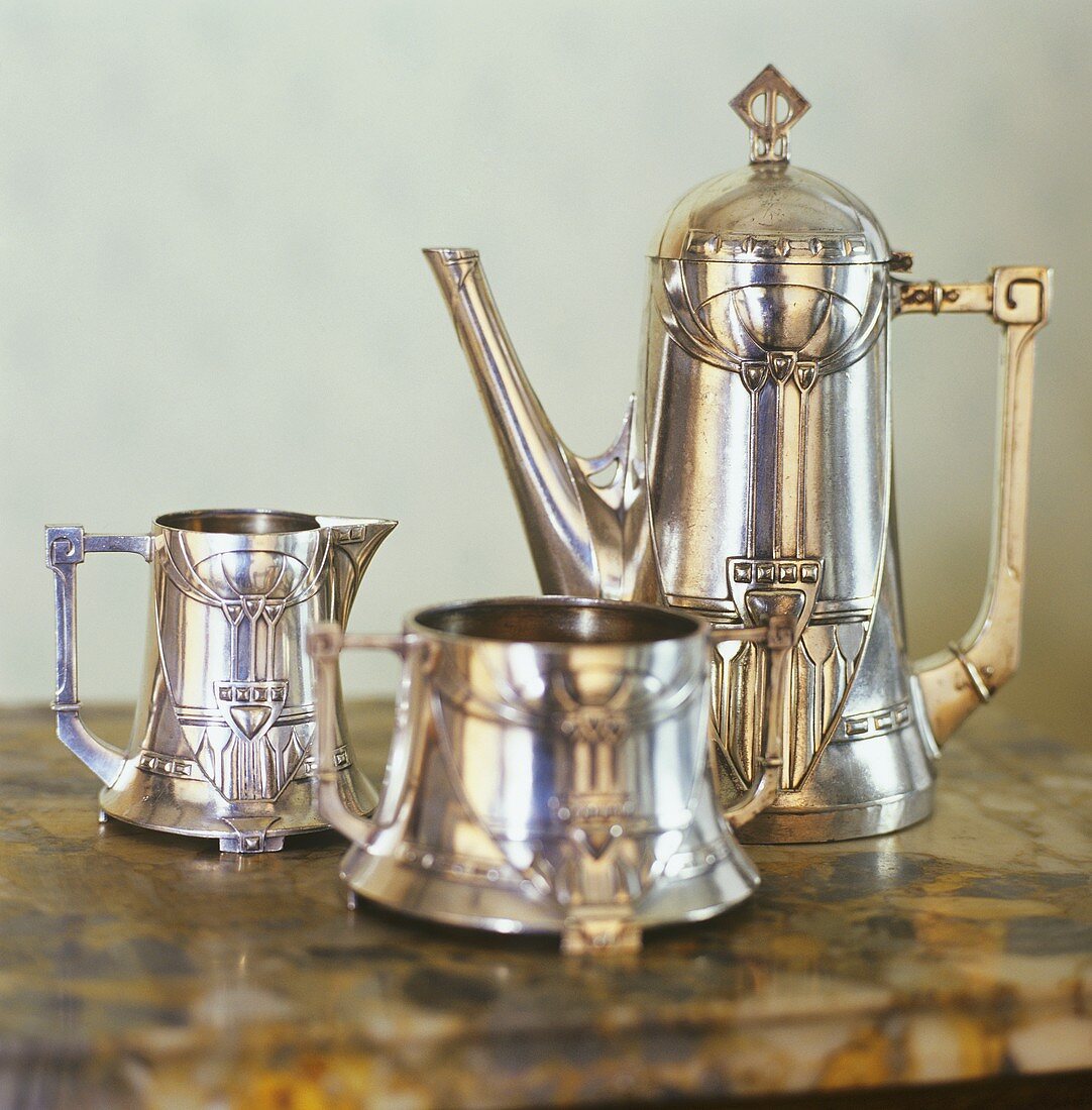 Silver coffee pot, cream jug and sugar bowl