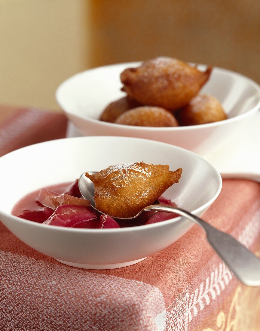 Deep-fried dough balls with rhubarb compote