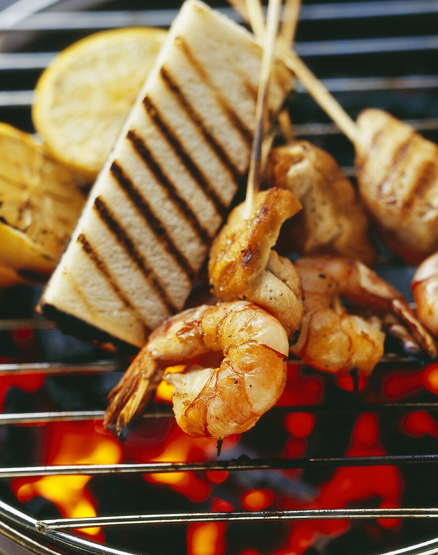 Grilled corn-fed chicken and scampi kebabs