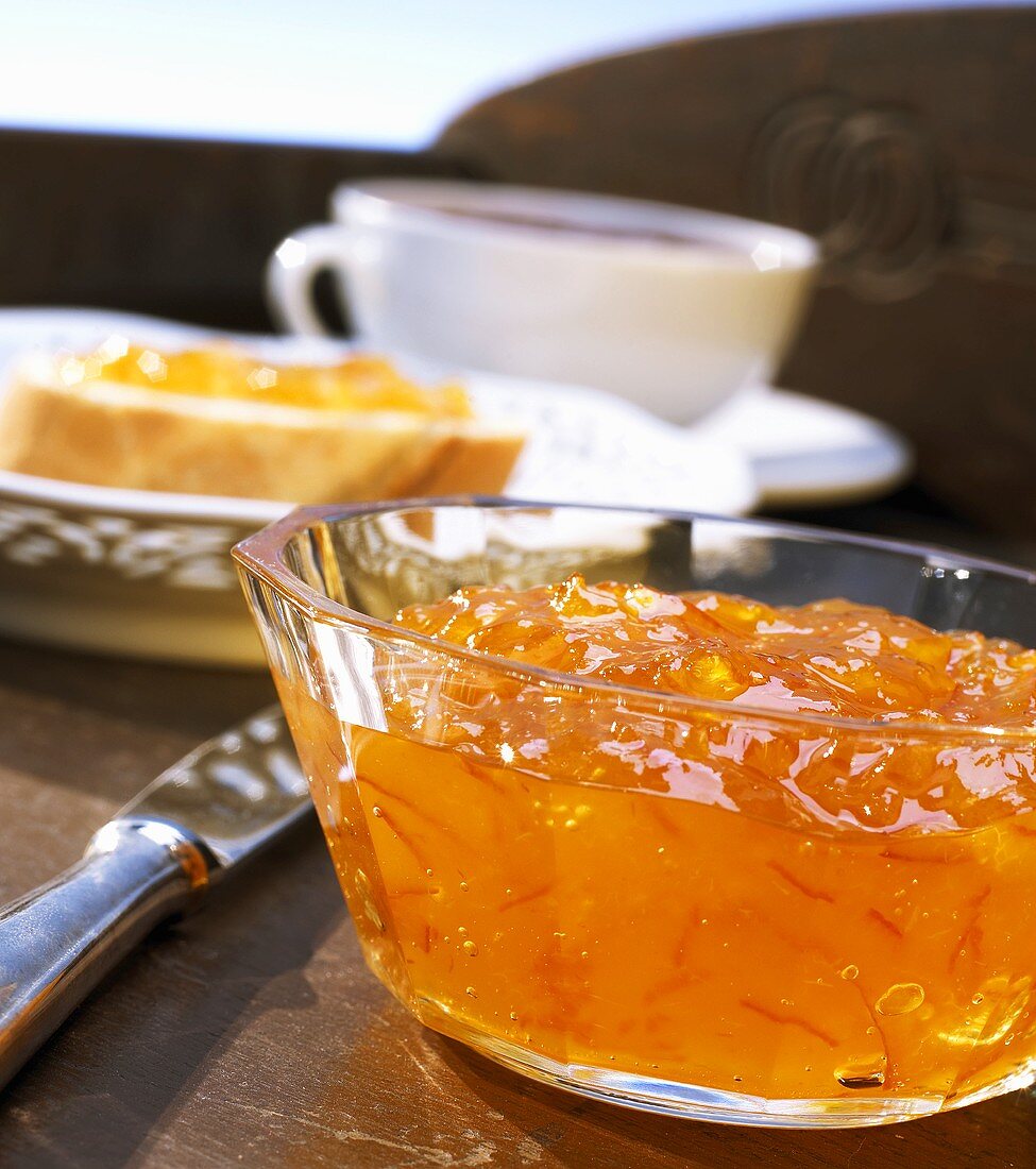 Orange marmalade in a small glass bowl