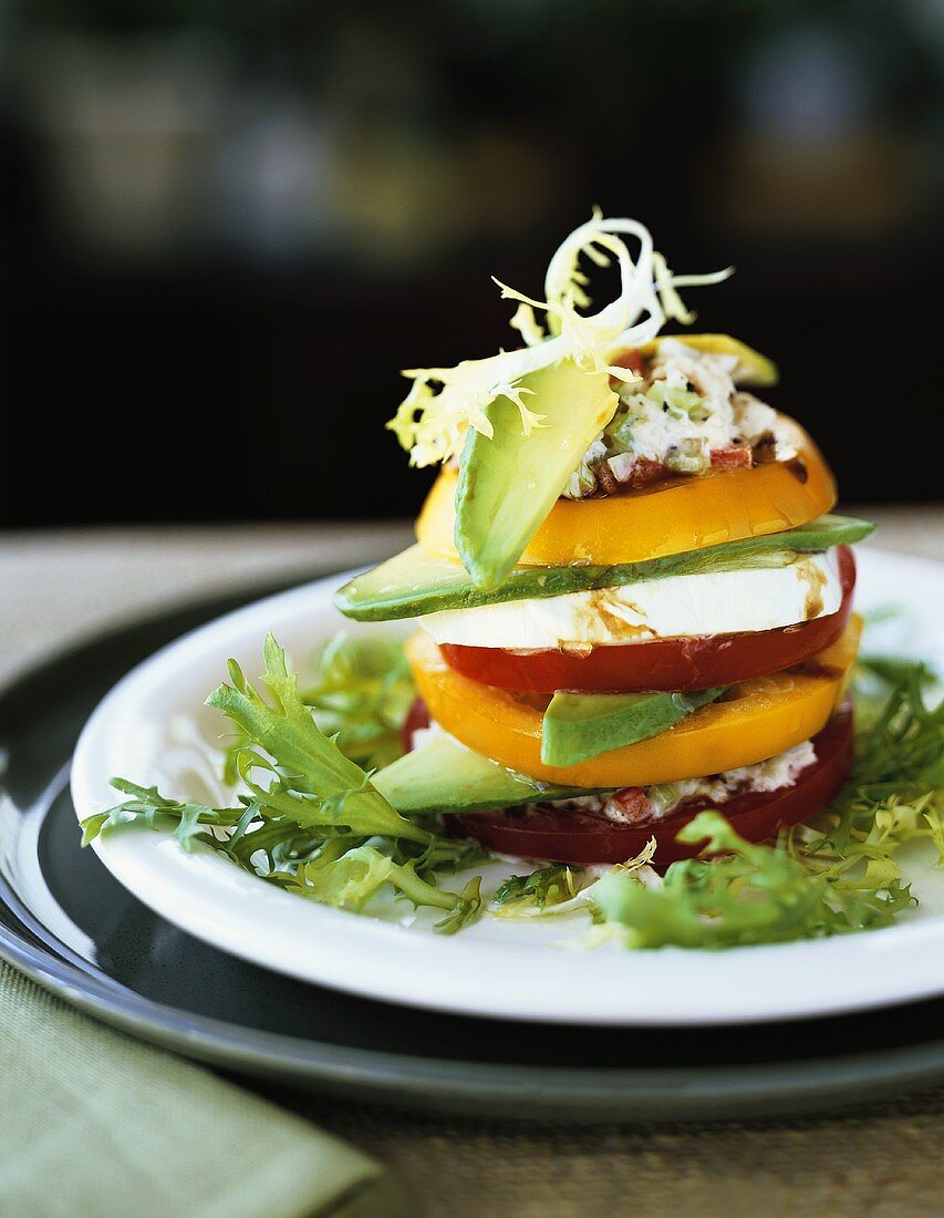 Tomato and avocado tower with mozzarella and crabmeat