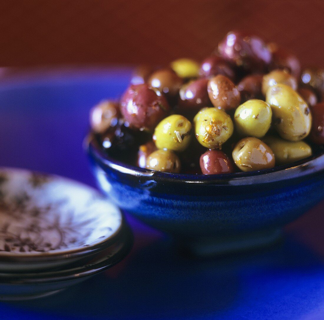 Mixed olives with herbs in a bowl