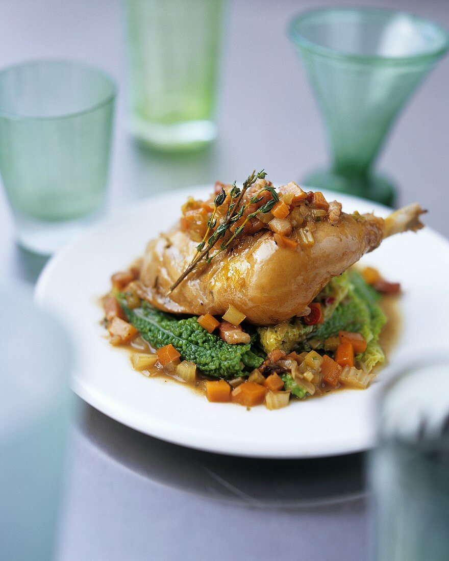 Chicken leg with hearty vegetables and thyme