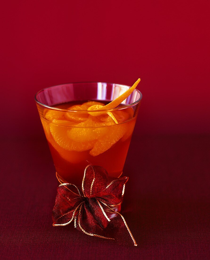 Mandarin orange punch in glass with bow