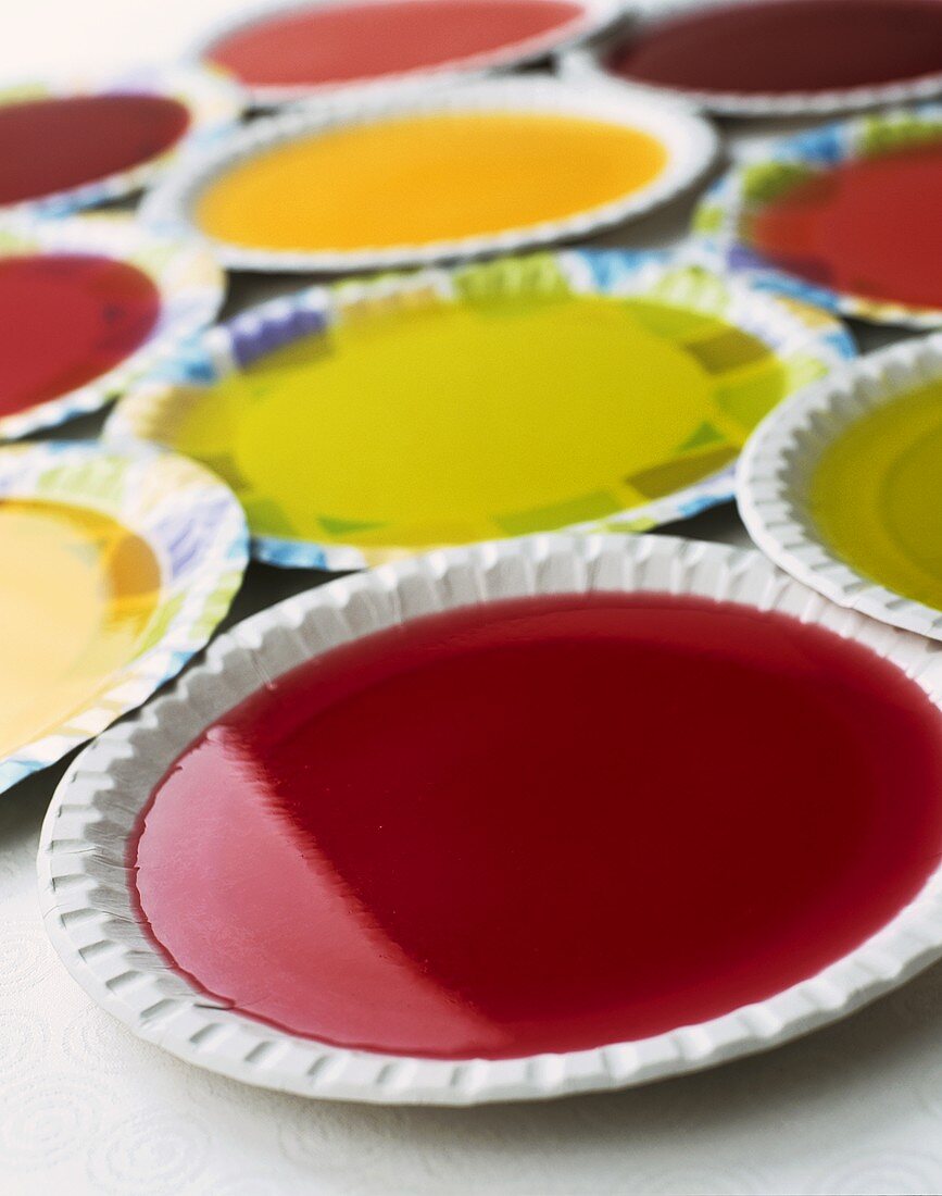 Coloured jellies on paper plates
