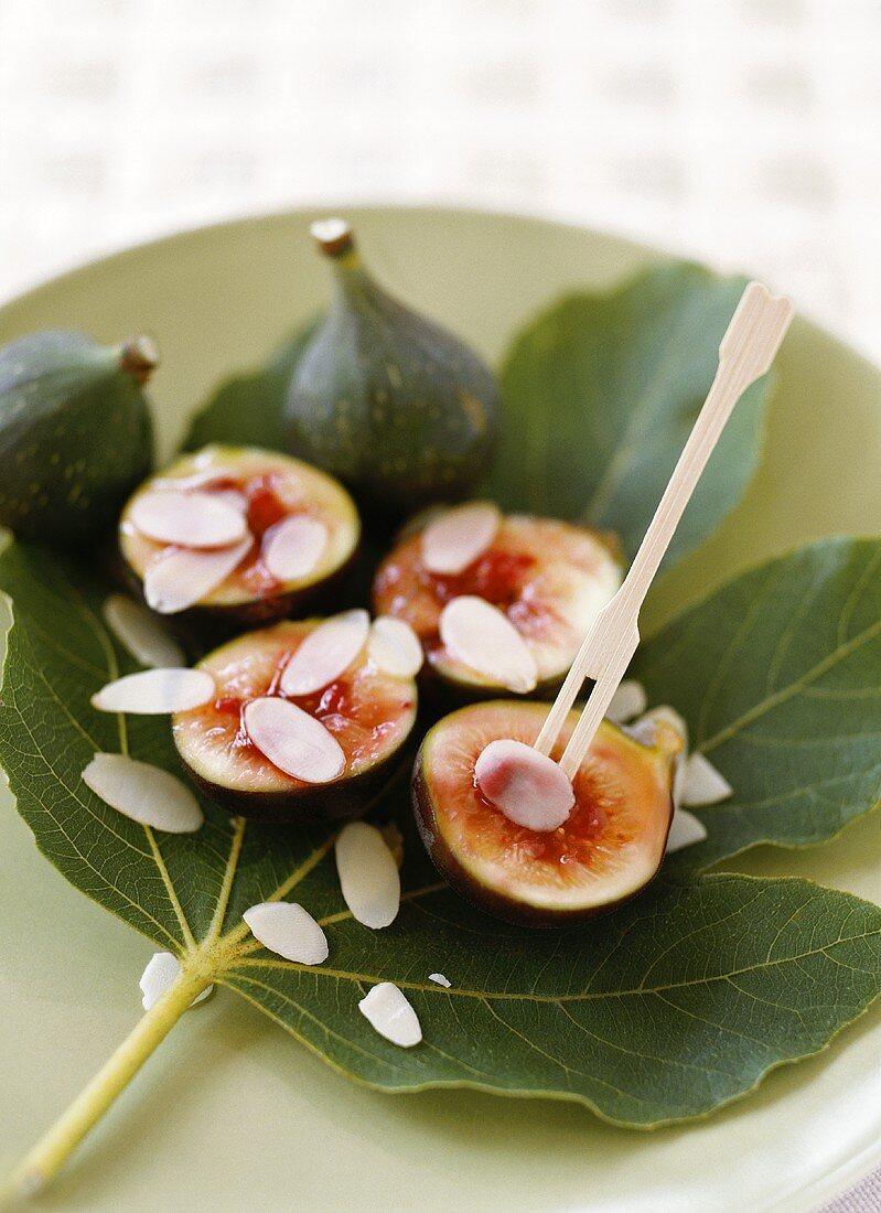 Halved figs with honey and flaked almonds