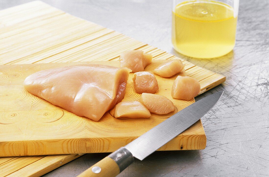 Chicken breast fillet, partly cut into small pieces