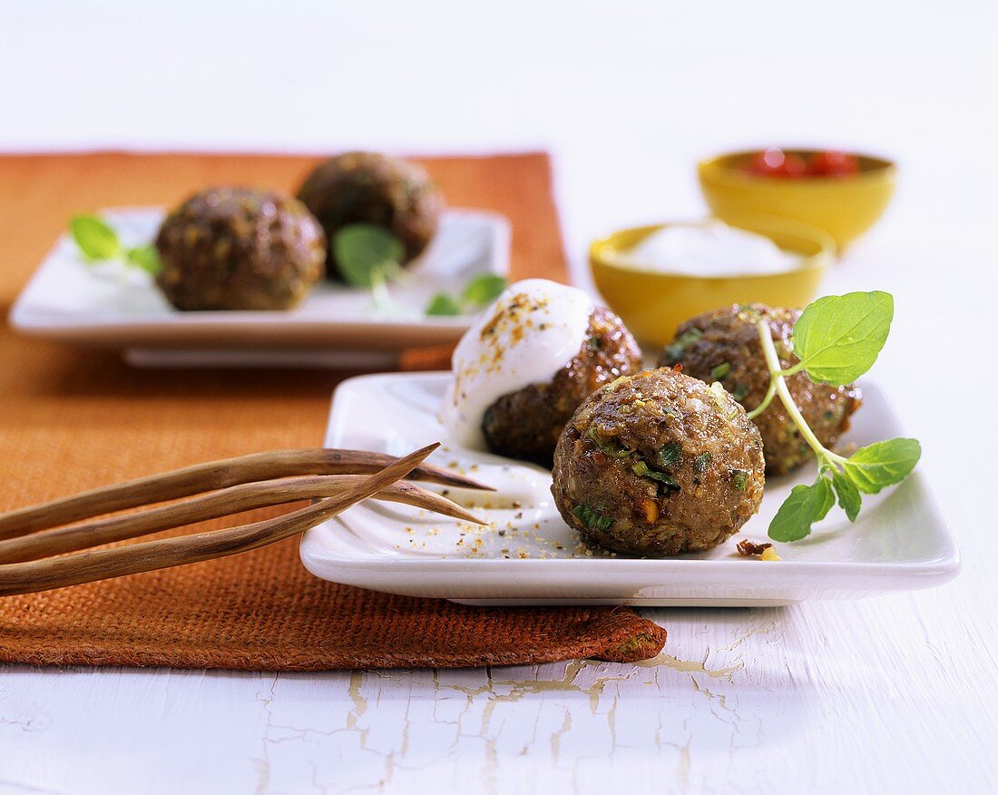 Meat and vegetables balls with dip