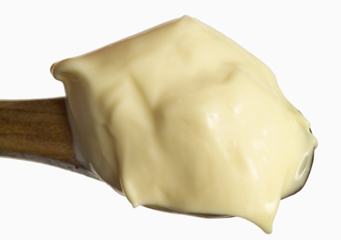 Mayonnaise on a wooden spoon