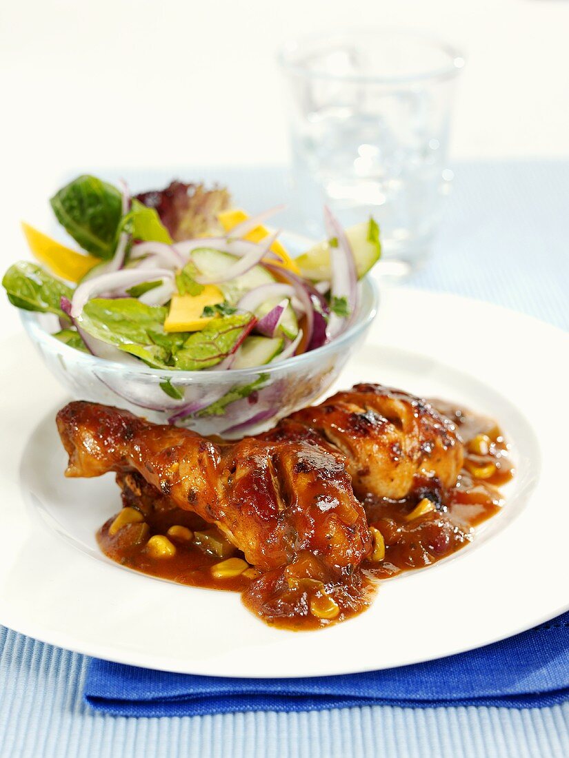 Chicken with chili sauce and salad