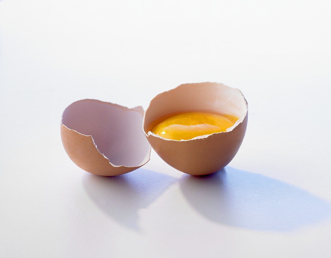 A brown egg, broken open