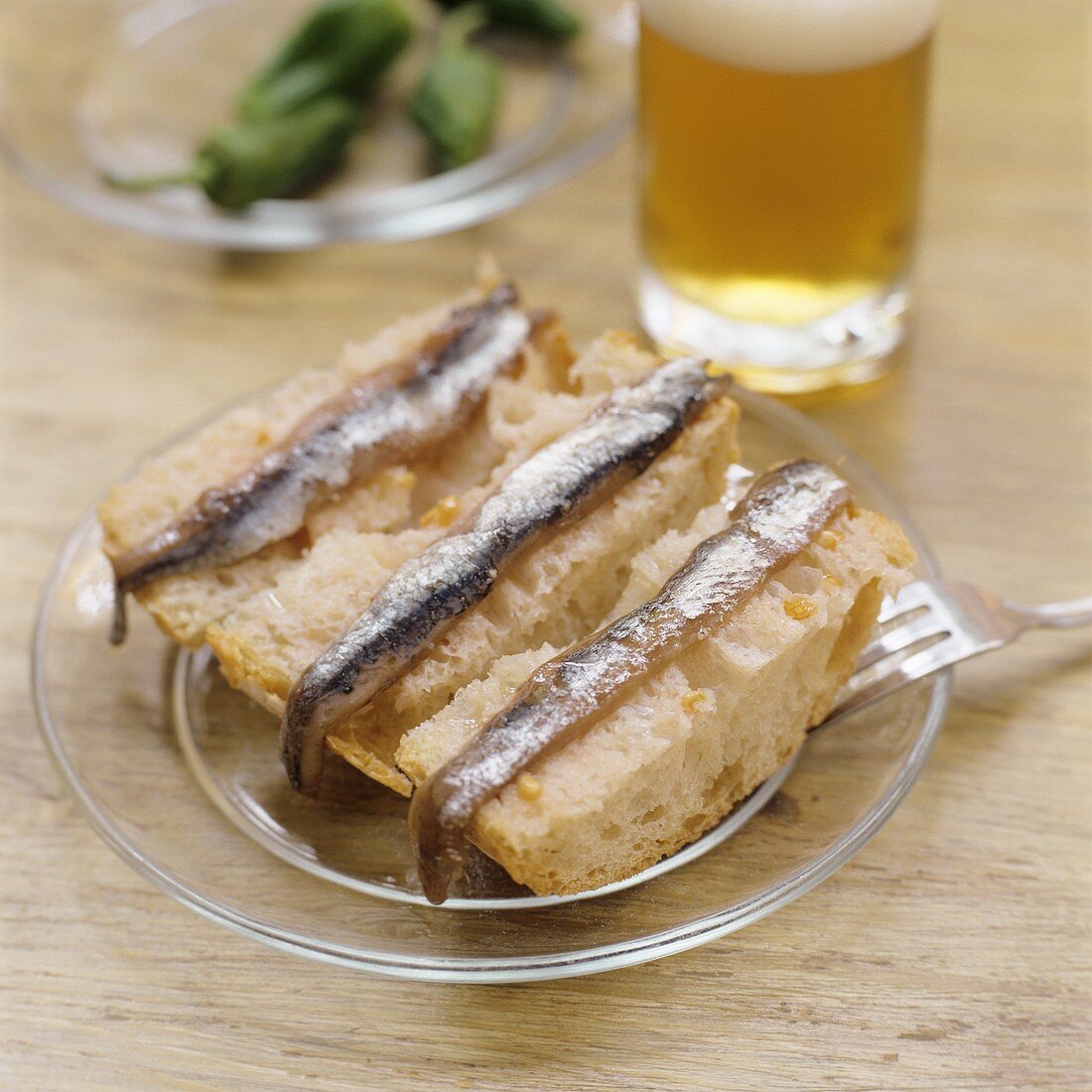 Anchovy fillets on slices of white bread