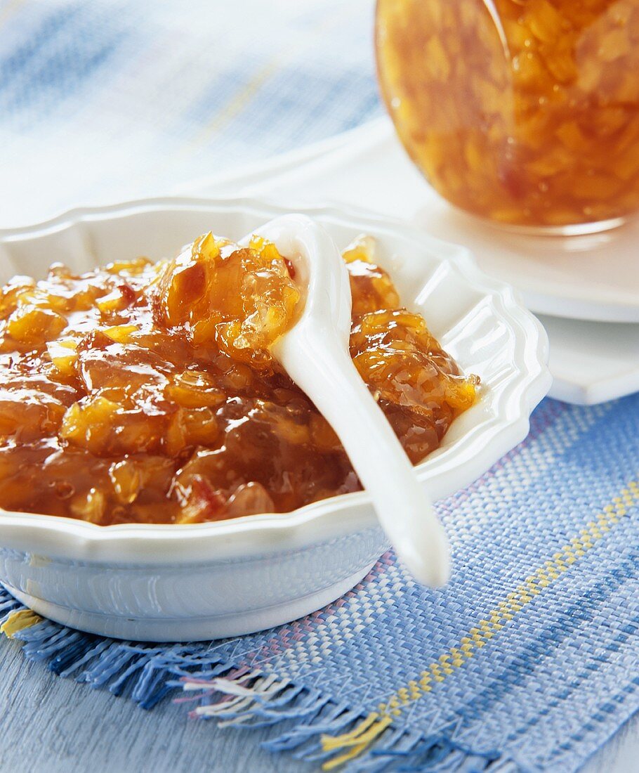 Nectarine and pineapple jam in a small bowl