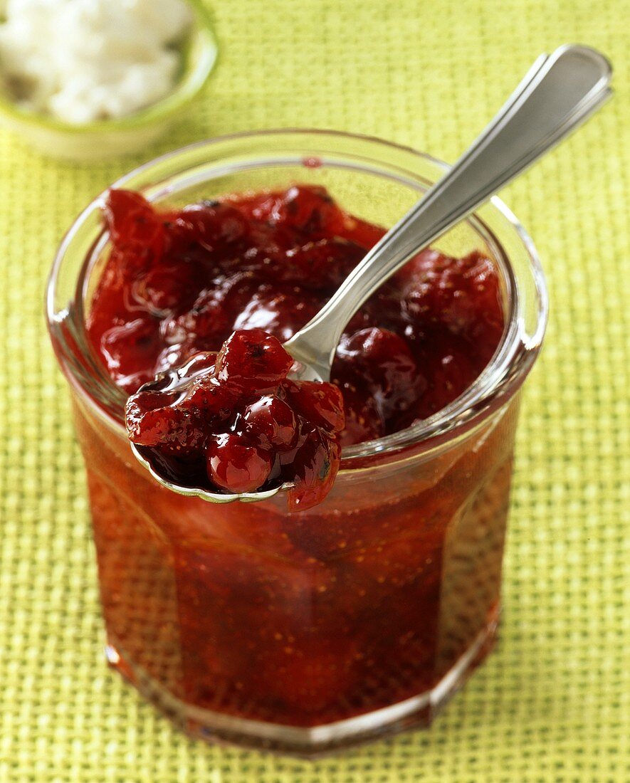 Strawberry and redcurrant jam in a jam jar