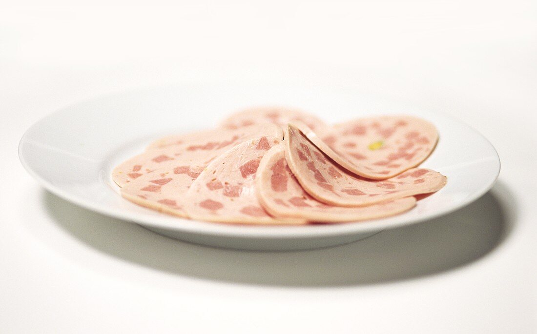 Bierschinken (ham sausage) on a plate, sliced
