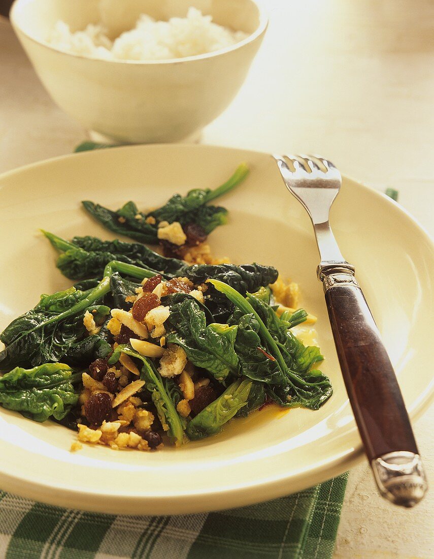 Spinach with raisins and slivered almonds