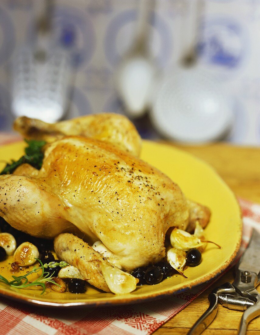 Roast chicken with olives and garlic cloves