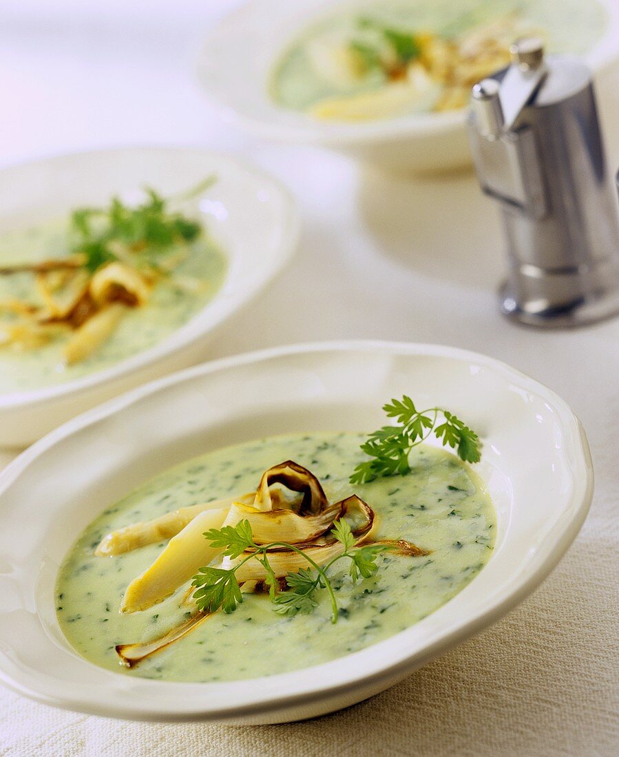 Creamed asparagus soup with parsley and roasted asparagus