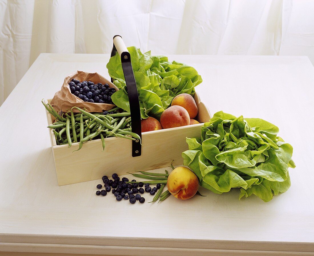 Fruit and vegetables in a wooden crate