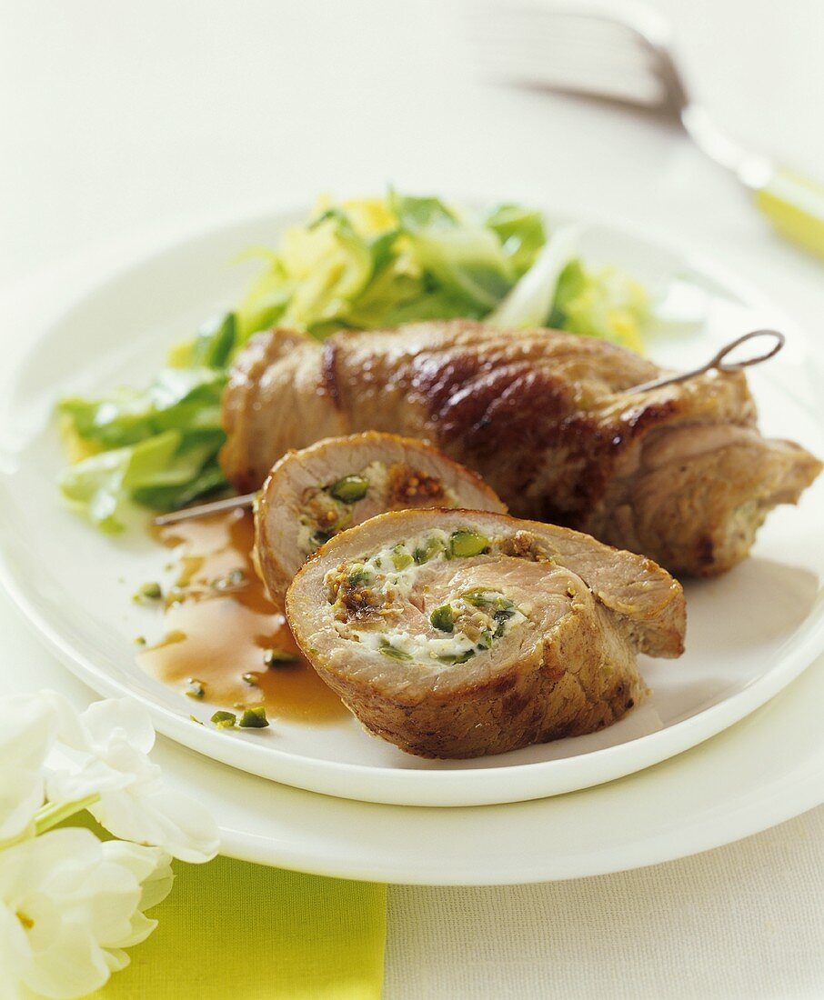 Veal roulades filled with pistachio, ham and fig cream