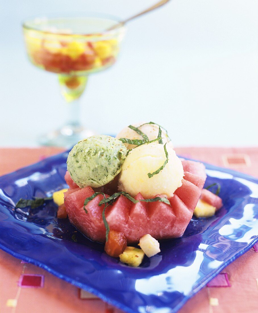 Three scoops of sorbet on watermelon