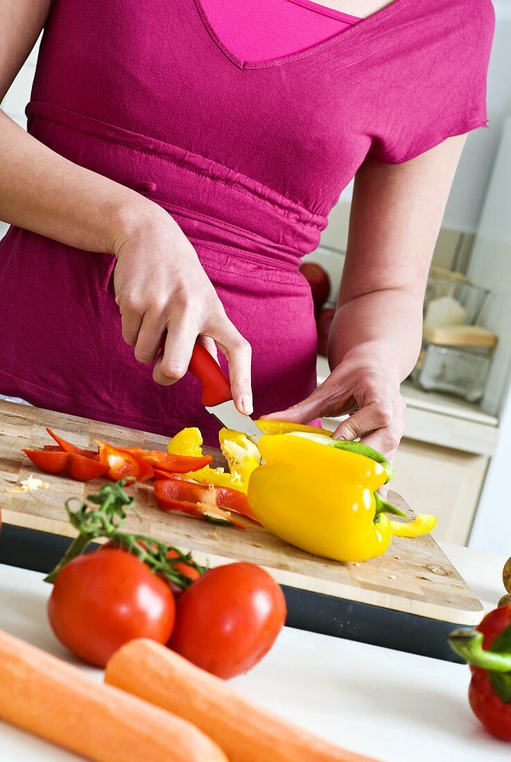 Woman slicing vegetables (detail)