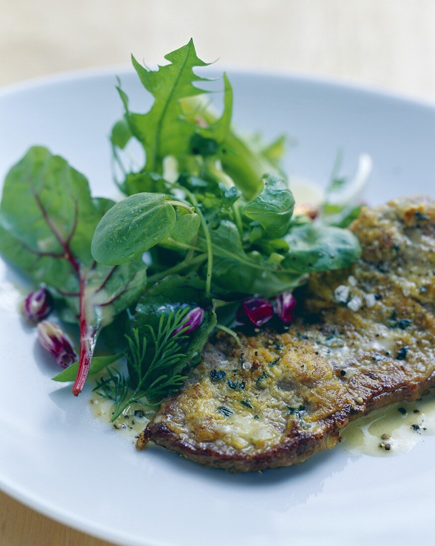 Fried beef sirloin with thyme & mustard crust, herb salad