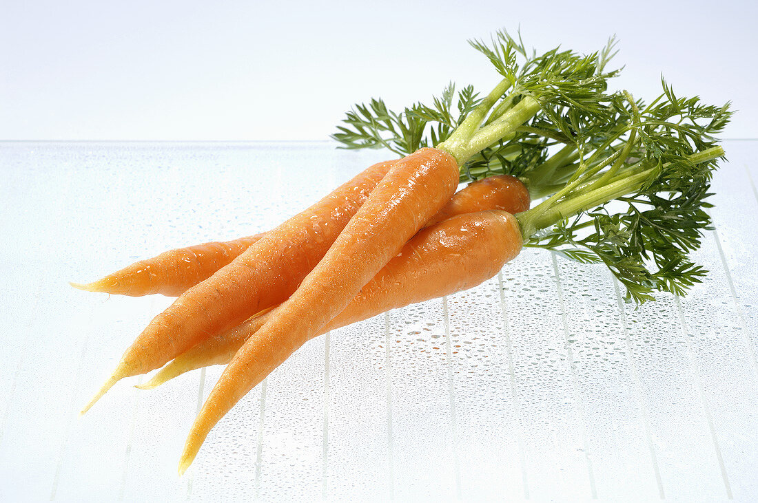 Fresh carrots with drops of water
