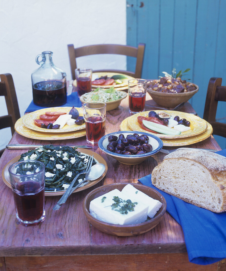 Table laid with an assortment of Greek dishes