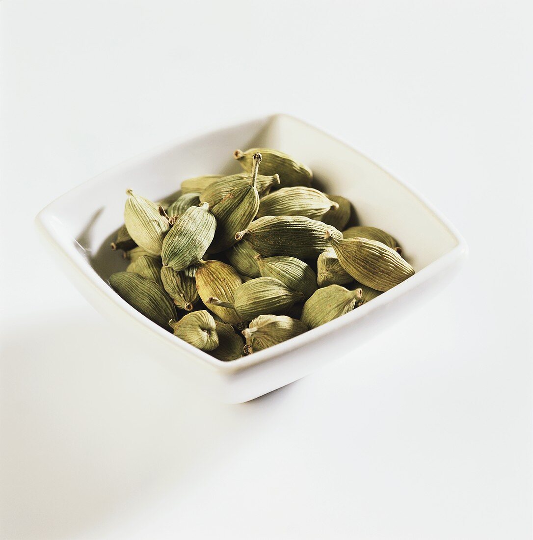 Cardamom pods in a bowl