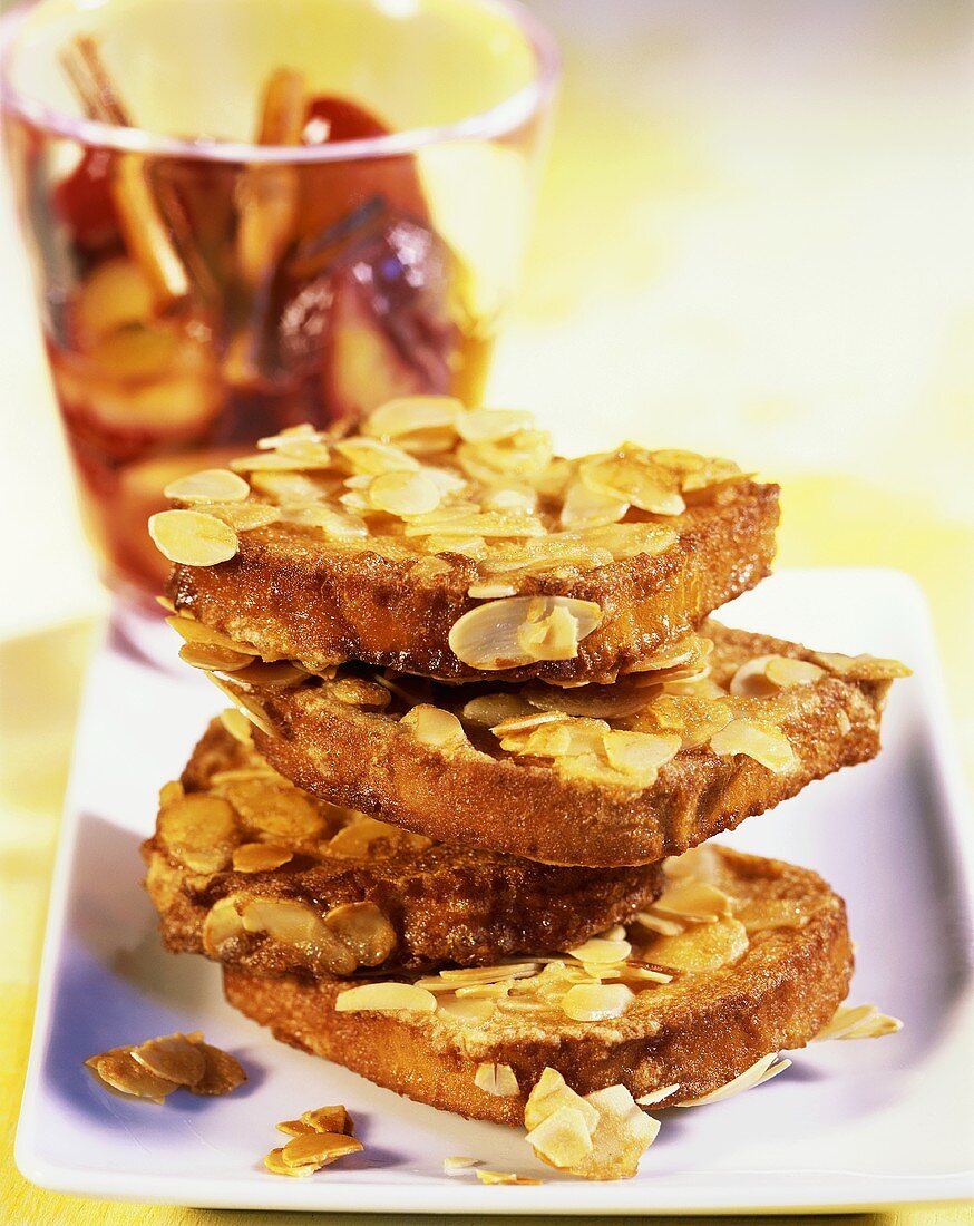 French toast with flaked almonds and plum compote