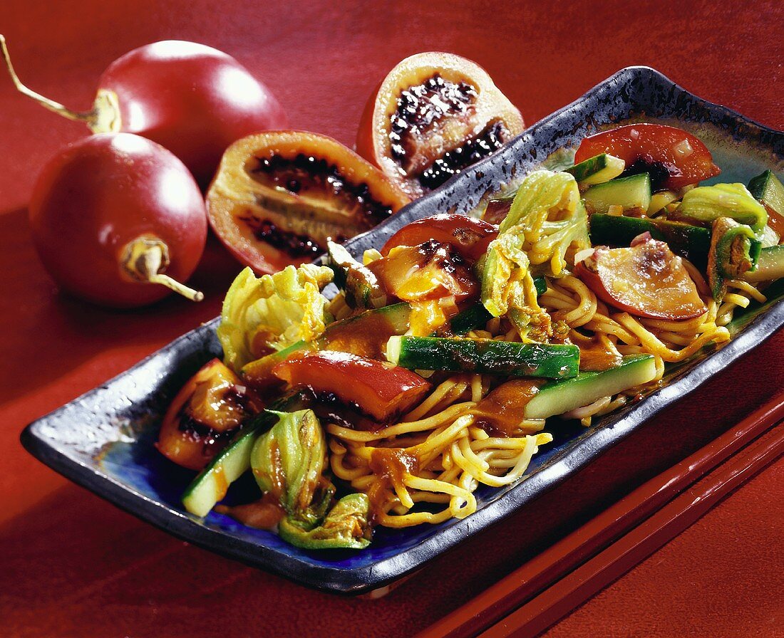 Curried noodles with flowers and Asian tamarillos