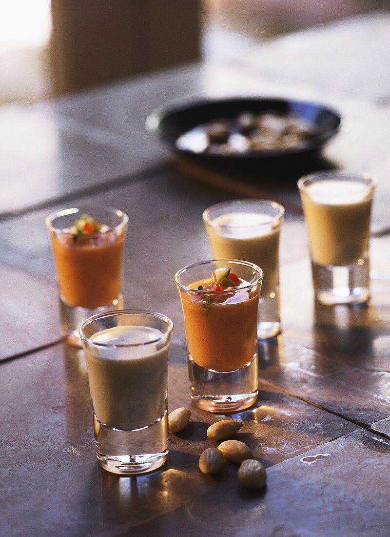 Almond soup and gazpacho in small glasses