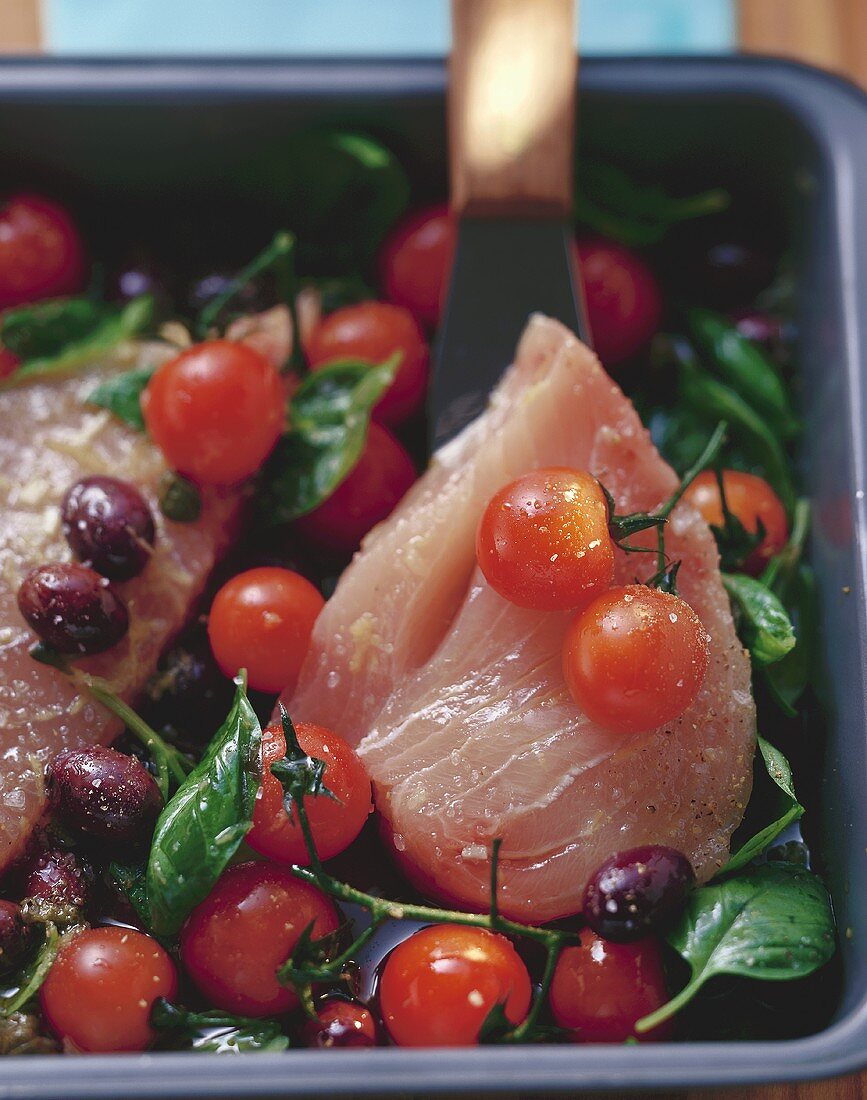 Swordfish with cocktail tomatoes, capers and olives