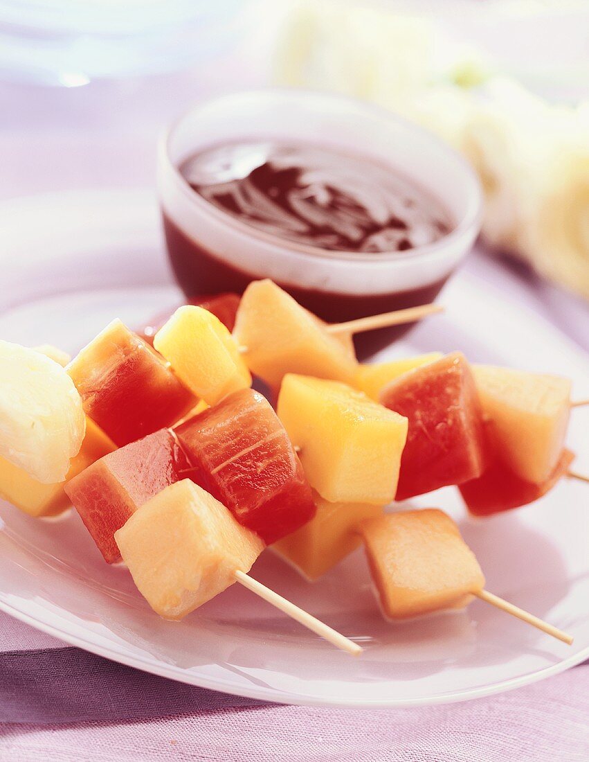 Skewered fruit with chocolate sauce
