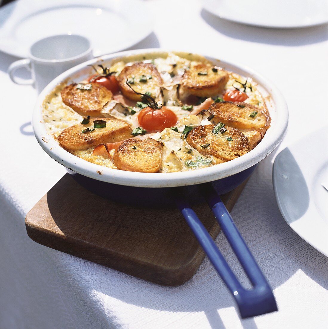 Frittata with ham and baguette slices