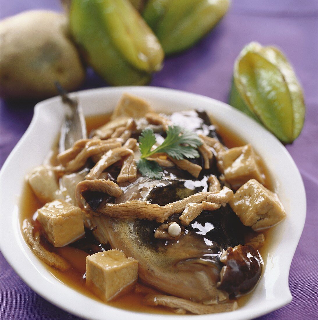 Fish head with tofu, pork and mushrooms