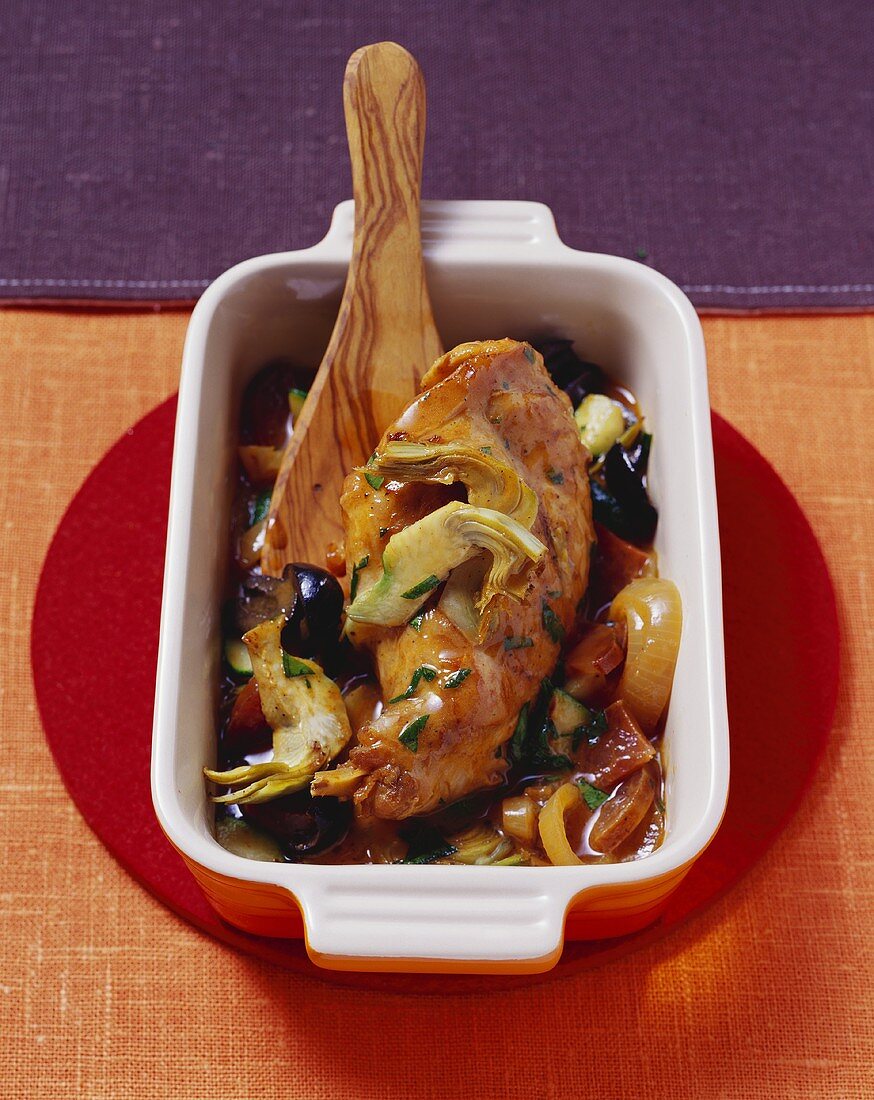 Braised rabbit legs with artichokes and chorizo