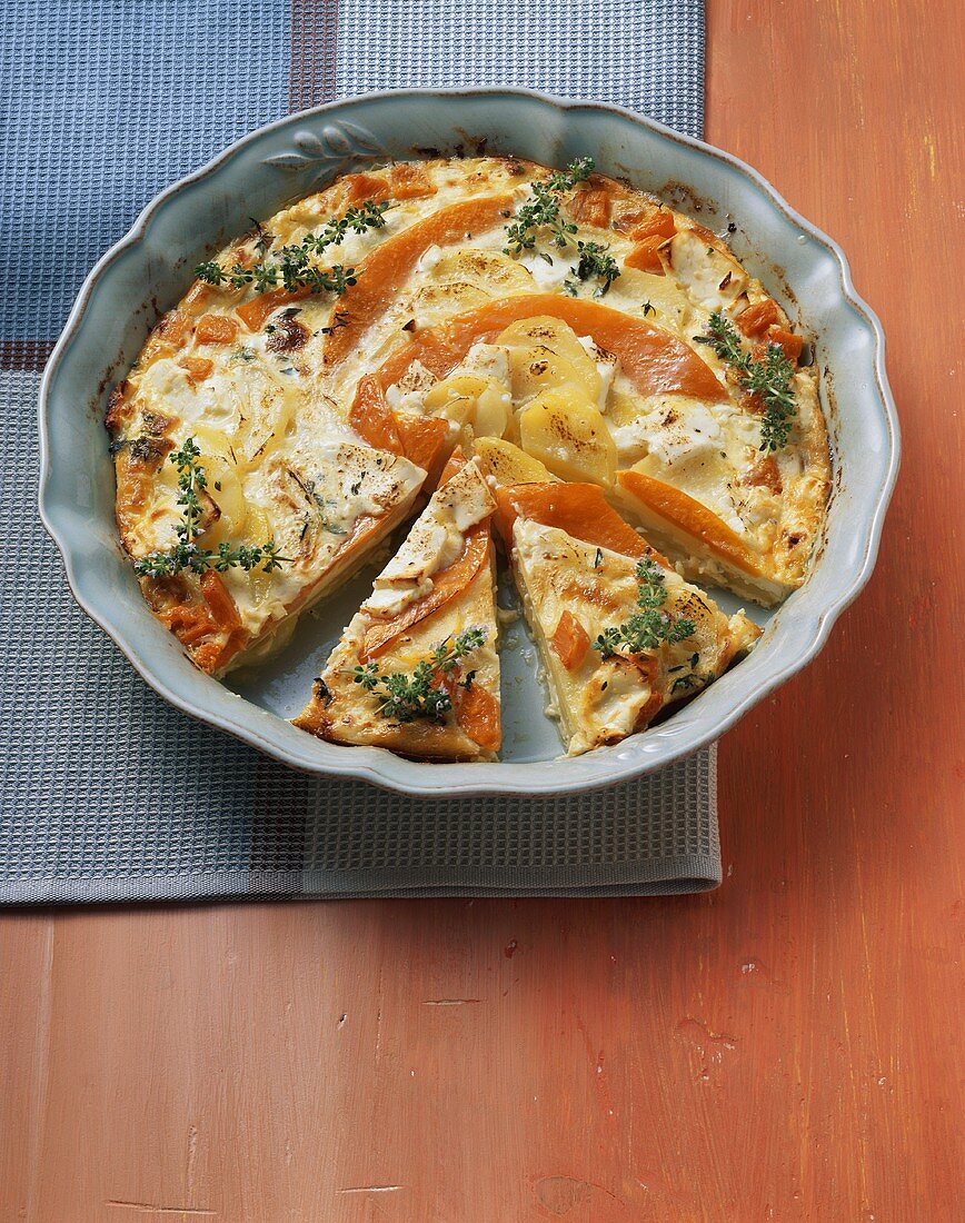 Potato and pumpkin gratin with sheep's cheese and thyme