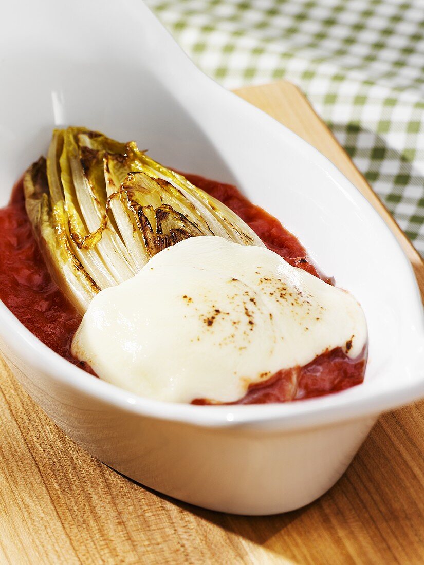 Baked chicory with mozzarella and tomato sauce