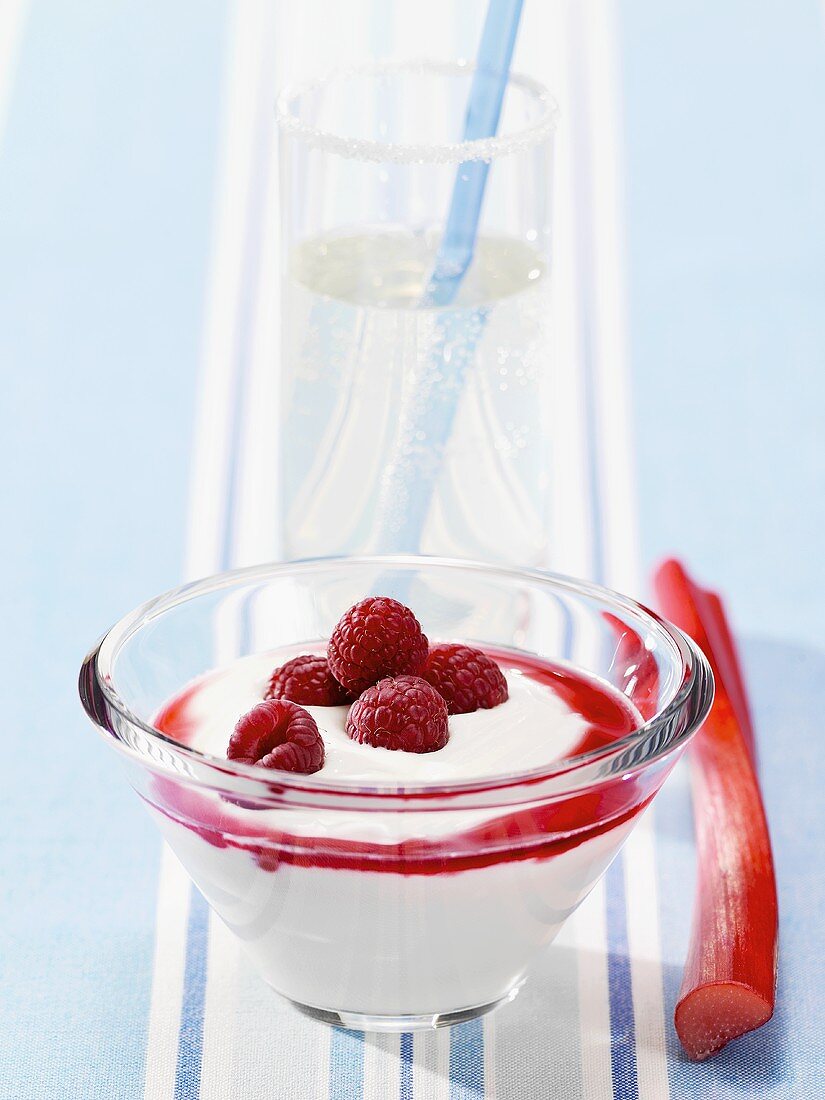 Yoghurt with raspberries and rhubarb syrup