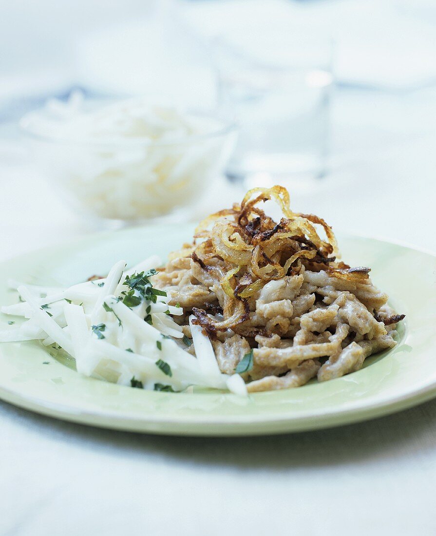 Wholemeal cheese spaetzle with fried onions & radish salad
