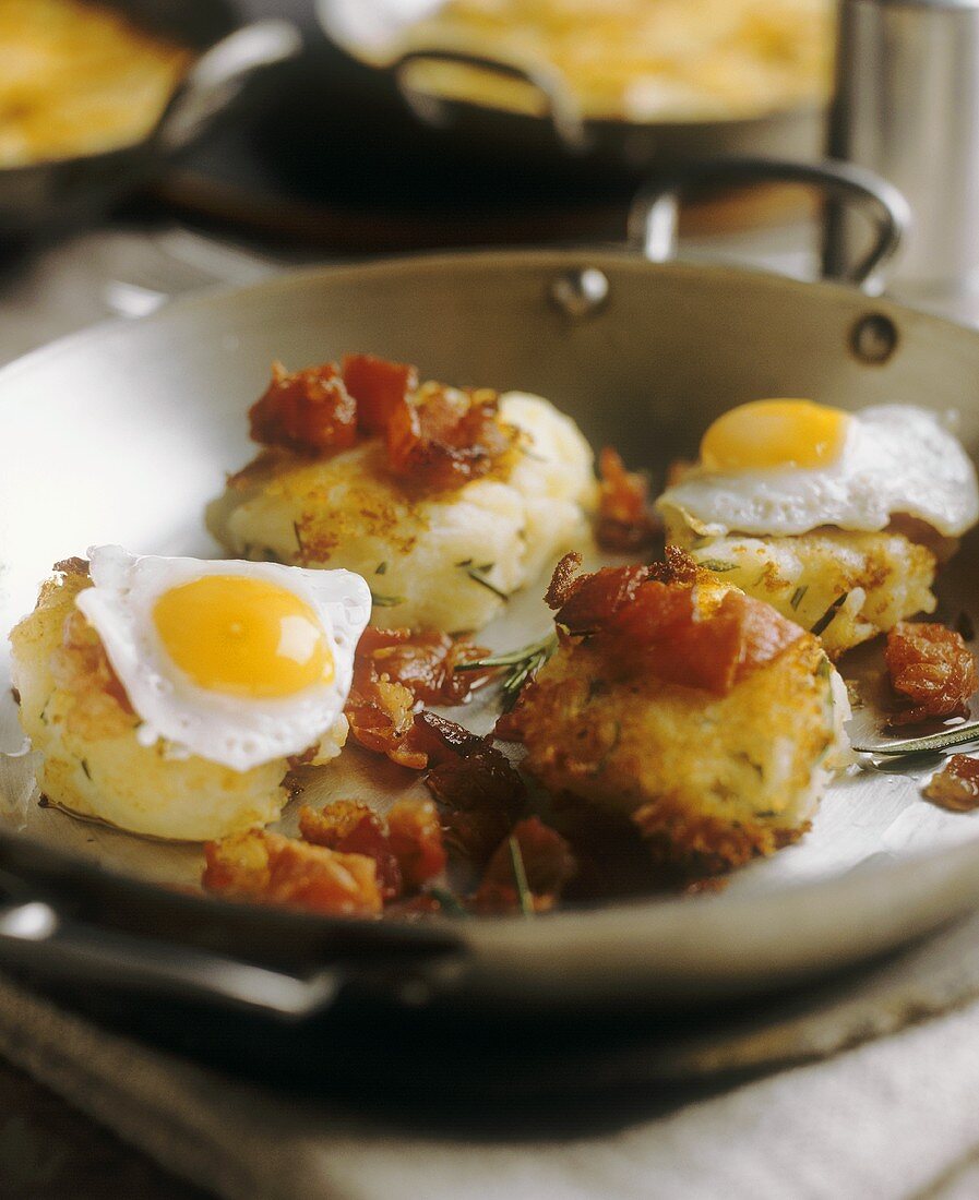 Small potato rosti with fried eggs and bacon