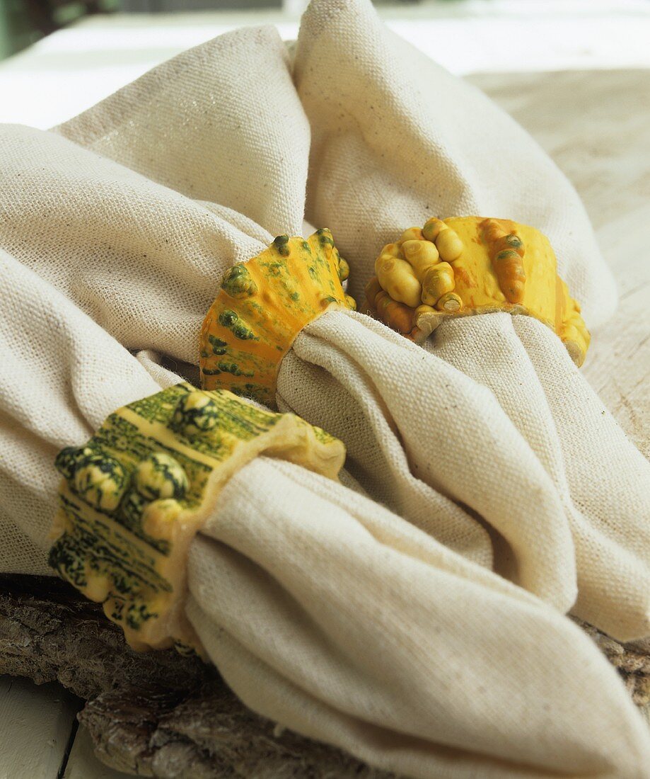 Napkins with napkin rings made from ornamental gourds