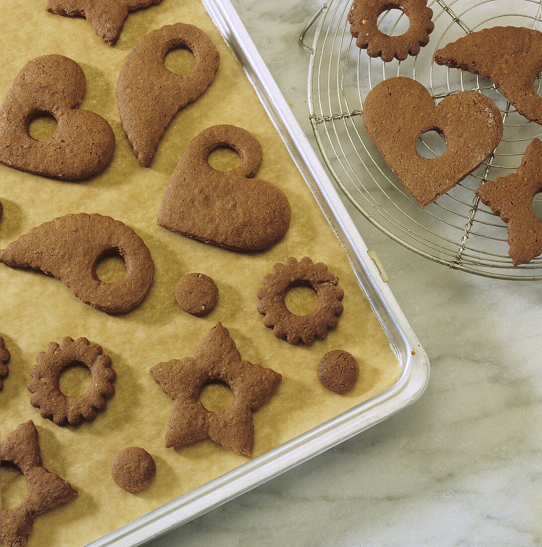 Gingerbread biscuits (to hang on the Xmas tree) on baking tray