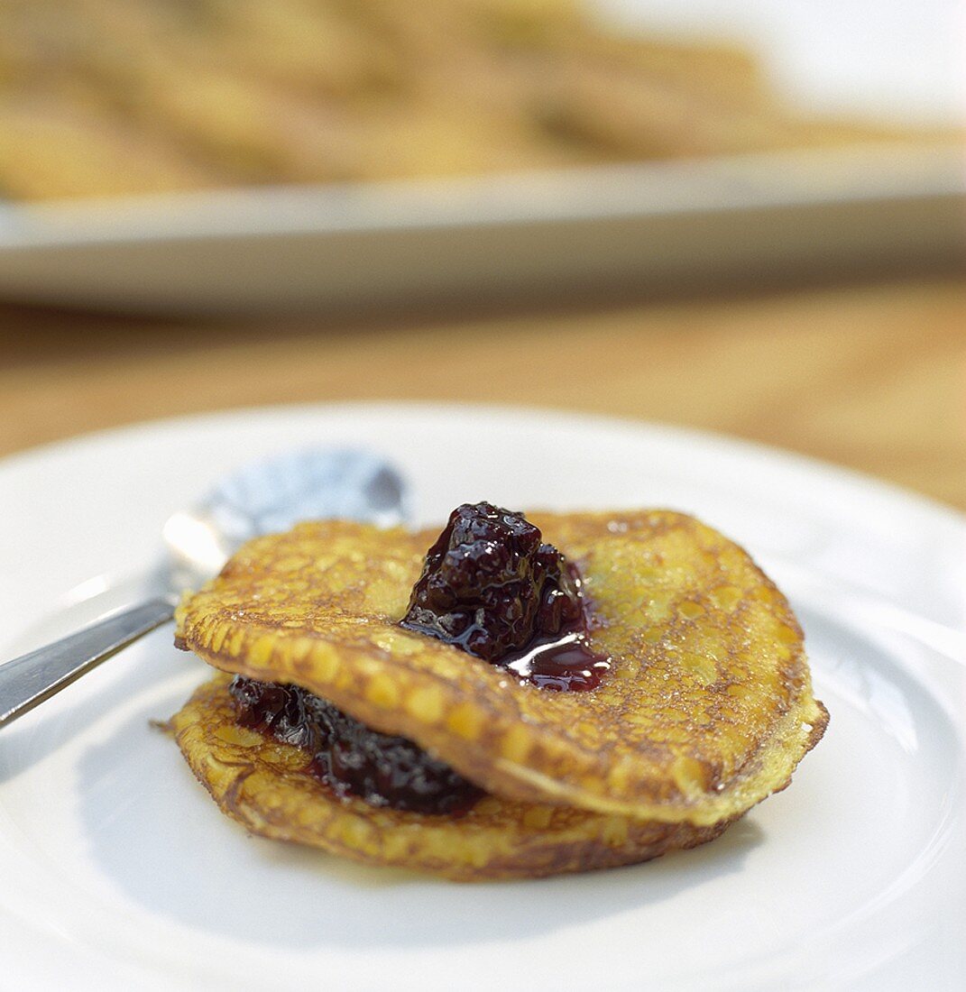 Sweet saffron pancakes with blackberry compote