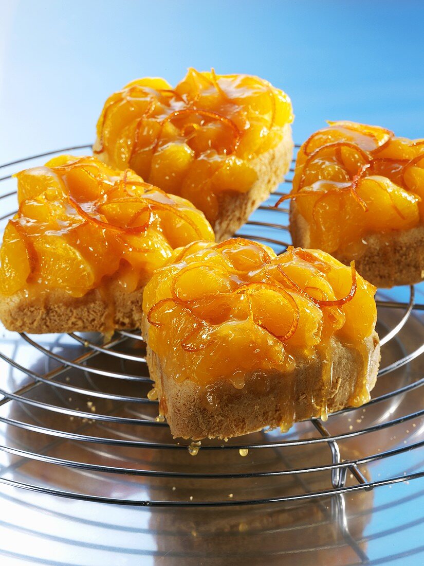 Heart-shaped vanilla sponge cakes topped with mandarin oranges